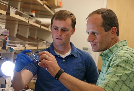 Alex Jafek (left) works with his Ph.D. adviser Prof. Bruce Gale in the State of Utah Center of Excellence for Biomedical Microfluidics