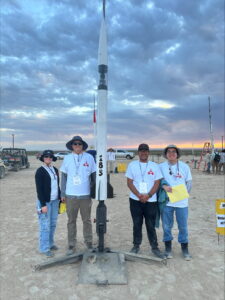 utah rocket club team poses with rocket